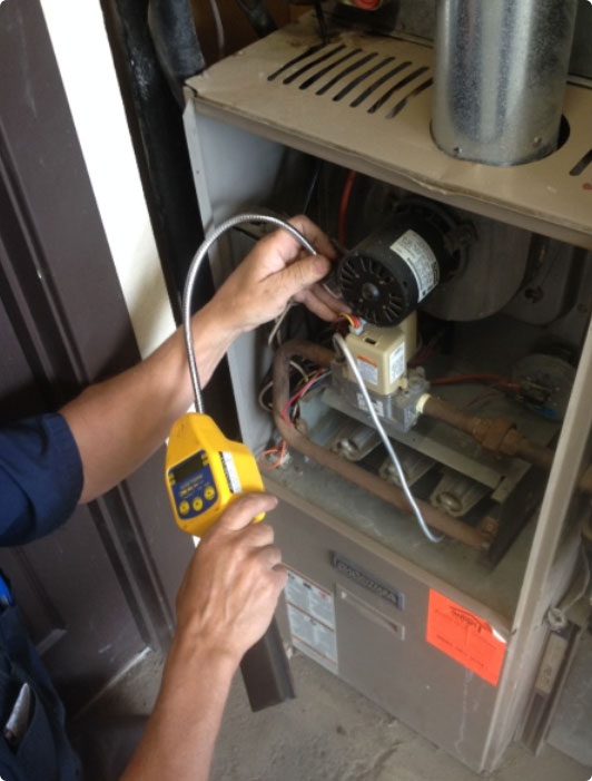 Alberta Indoor Comfort technician repairing unit